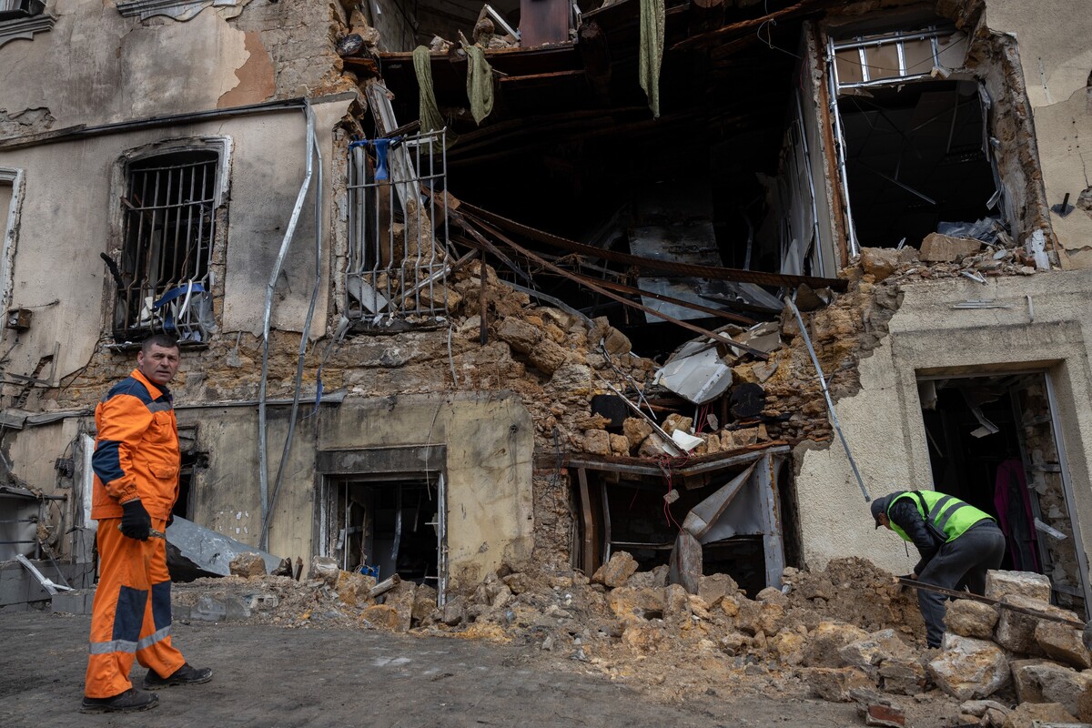 Municipal workers clear the rubble of residential building damaged after a Russian drone strike in Odesa, Ukraine, on Thursday, March 19, 2026. (AP Photo/Oleg Grekov)