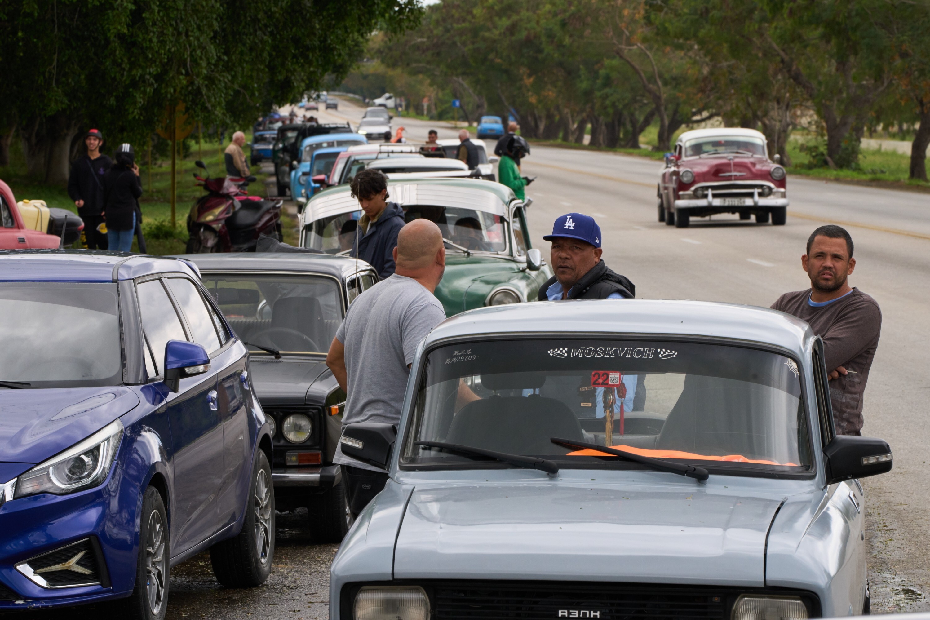 Drivers wait in a long line to enter a gas station in Bacuranao near Havana, Cuba, Friday, Jan. 30, 2026. (AP Photo/Ramon Espinosa)