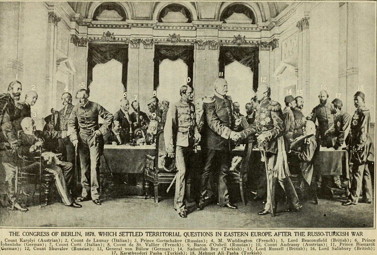 Anton von Werner’s painting The Congress of Berlin (1881), depicting the final meeting at the Reich Chancellery on July 13, 1878. Bismarck, representing Germany, stands at the center between Gyula Andrássy of Austria-Hungary and Pyotr Shuvalov of Russia. On the left are Alajos Károlyi of Austria-Hungary, the seated Alexander Gorchakov of Russia and Benjamin Disraeli of Britain. The Ottoman delegation stands at the far right: Sadullah Pasha, Karatheodori Pasha and Mehmed Ali Pasha.