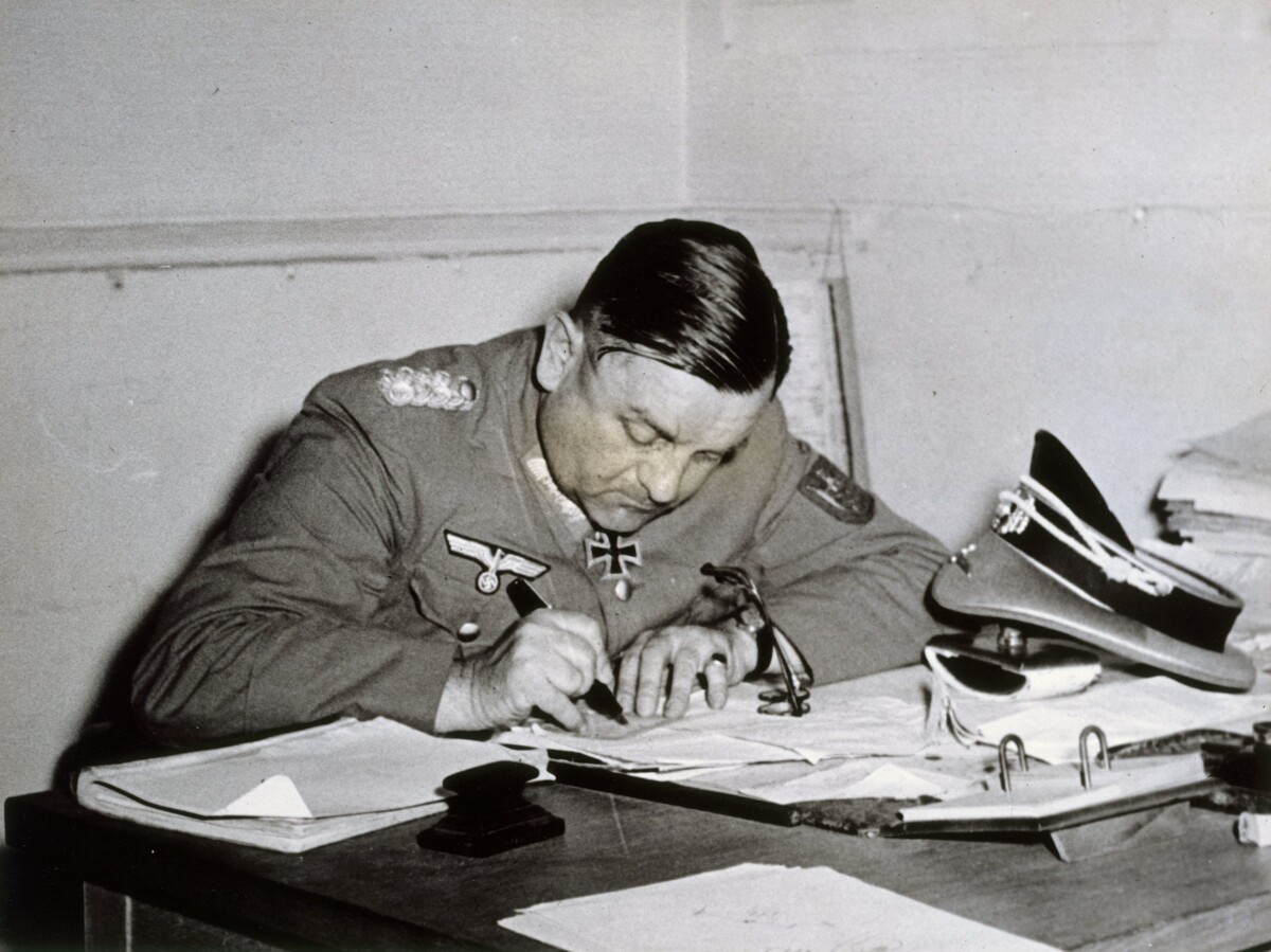 Dietrich von Choltitz signs the German surrender after the liberation of Paris