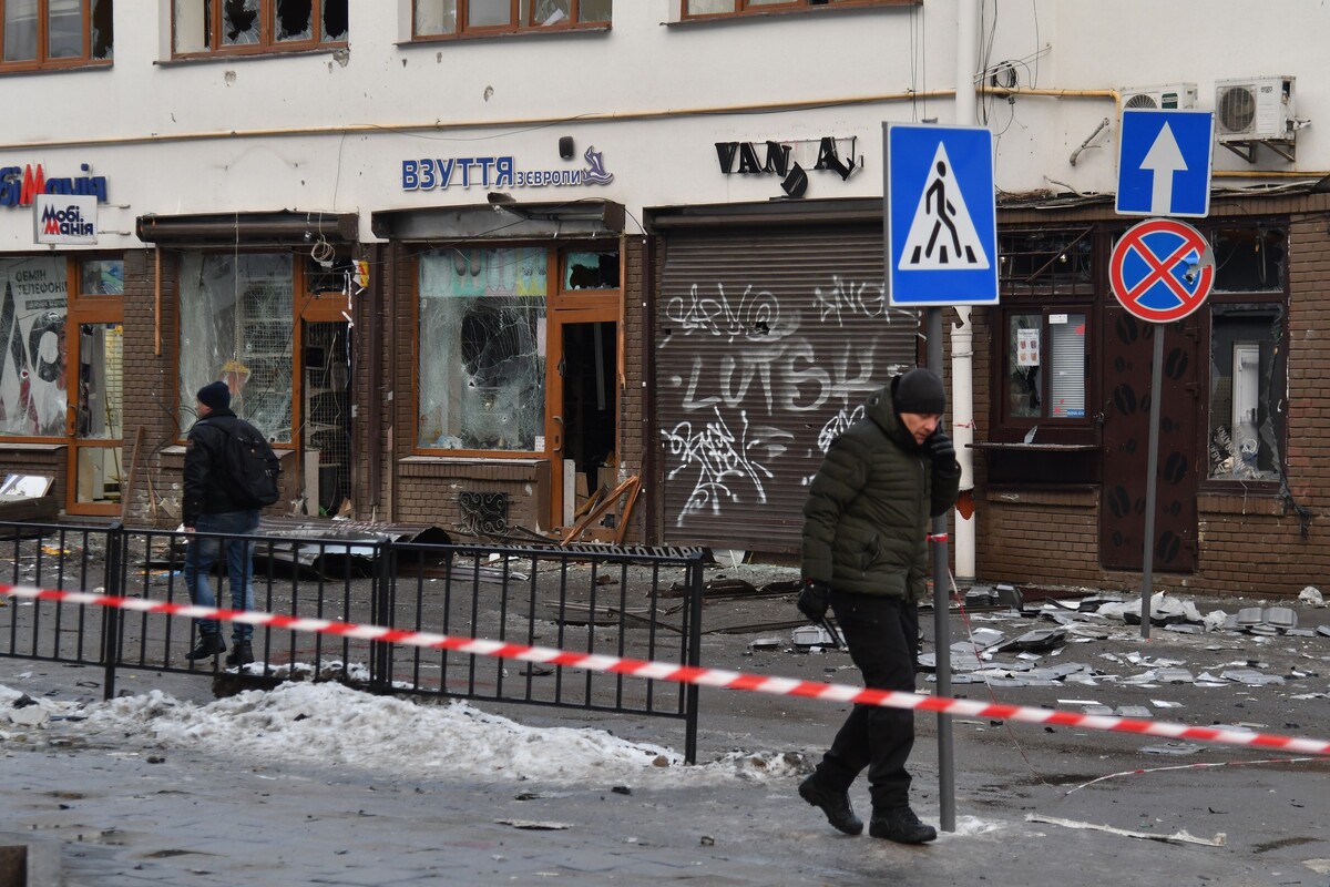 People pass by the scene of what authorities are describing as a "terrorist' attack" in central Lviv, Ukraine, Sunday, Feb. 22, 2026. (AP Photo/Mykola Tys)