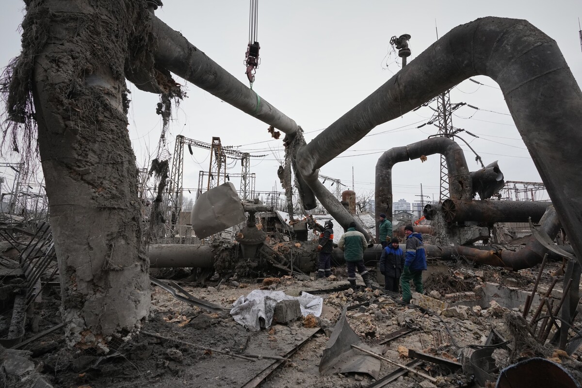 Workers clean up damage at Darnytsia Thermal Power Plant after a Russian attack in Kyiv, Ukraine, Wednesday, Feb. 4, 2026. (AP Photo/Sergei Grits)