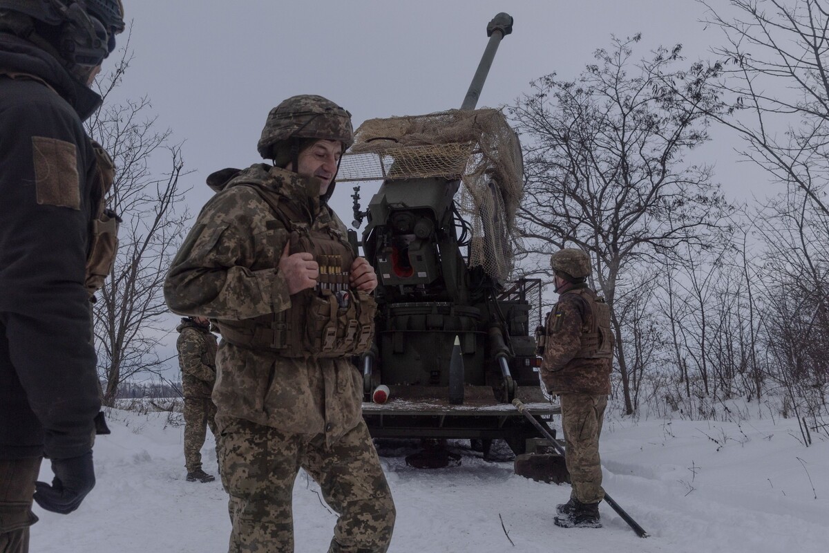 Ukrainian servicemen of the 48th artillery brigade fire a 2s22 Bohdana self-propelled howitzer towards Russian positions at the frontline in the Kharkiv region, Ukraine, Thursday, Jan. 1, 2026. (AP Photo/Yevhen Titov)