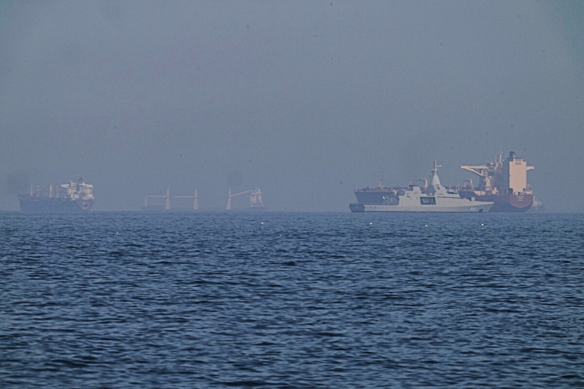 An Emirati patrol boat, second from right, is near a tanker anchored in the Gulf of Oman near the Strait of Hormuz, as seen from a coastal road near Khor Fakkan, United Arab Emirates, Friday, May 1, 2026. (AP Photo/Fatima Shbair)