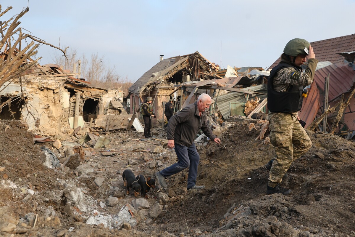A man walks in front his house destroyed after a Russian attack on Zaporizhzhia, Ukraine, Friday, Dec. 19, 2025. (AP Photo/Kateryna Klochko)