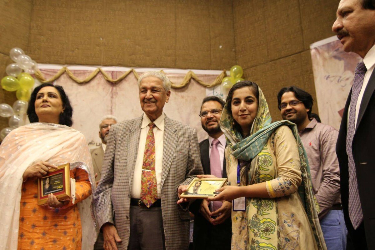 Khan at a literary conference with members of civil society in 2017. He died in 2021.