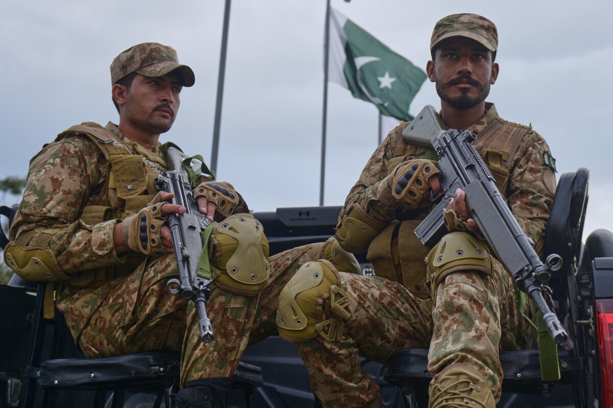 Army soldiers take positions in an overhead bridge to ensure security in Islamabad, Pakistan, Friday, April 24, 2026. (AP Photo/M.A. Sheikh)