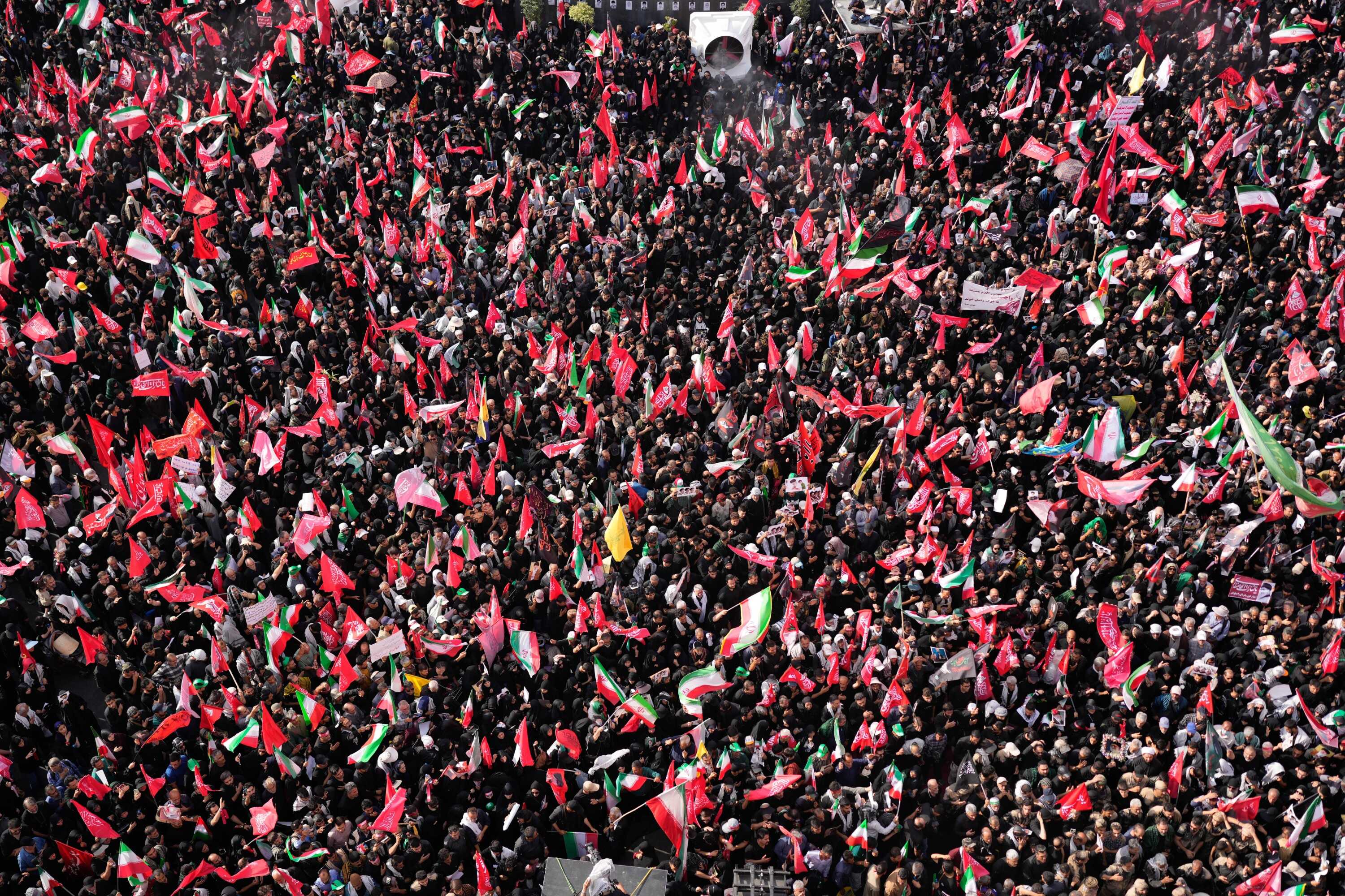 Mourners gather during the funeral procession of the slain Iranian Supreme Leader Ayatollah Ali Khamenei in Islamic Revolution Square in Tehran, Iran, Monday, July 6, 2026. (AP Photo/Altaf Qadri)
