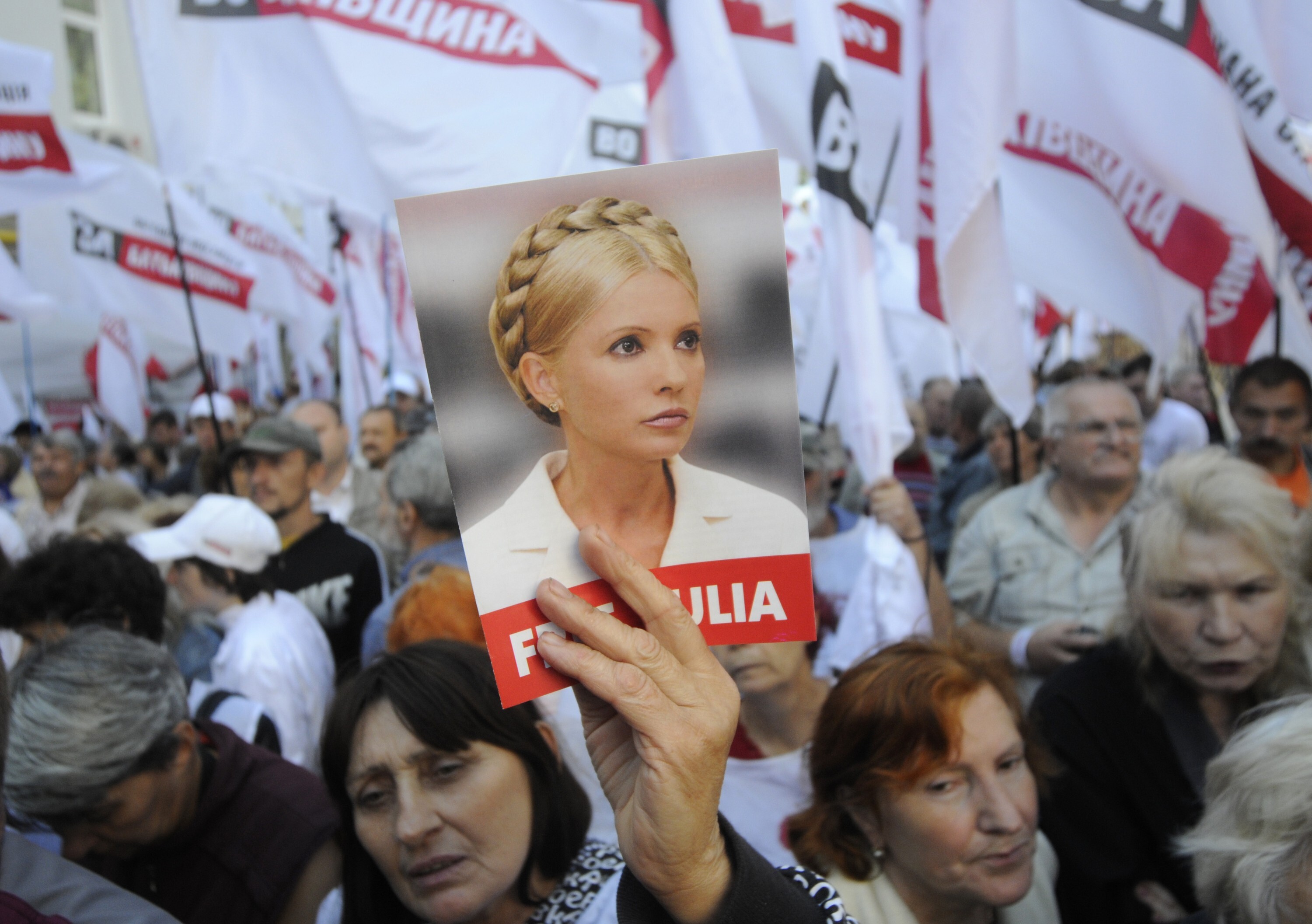 Supporters of former Ukrainian Prime Minister Yulia Tymoshenko take part in a rally outside Ukraine's High Specialized Court on Civil and Criminal Cases in Kiev Tuesday, Aug. 21, 2012. Ukraine's High Specialized Court for Civil and Criminal cases is hearing Tymoshenko's appeal of her conviction and seven-year sentence on charges of abusing her powers in signing a gas deal with Russia. (AP Photo/Sergei Chuzavkov)