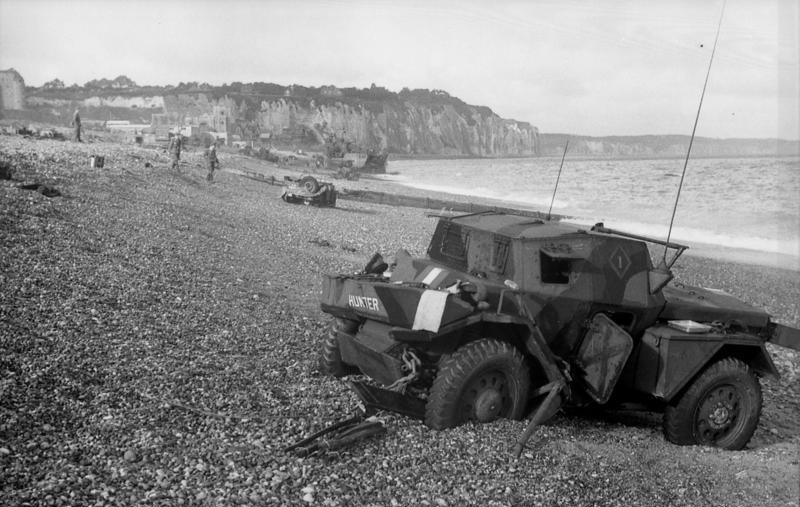 Abandoned, damaged British Daimler Dingo on the beach