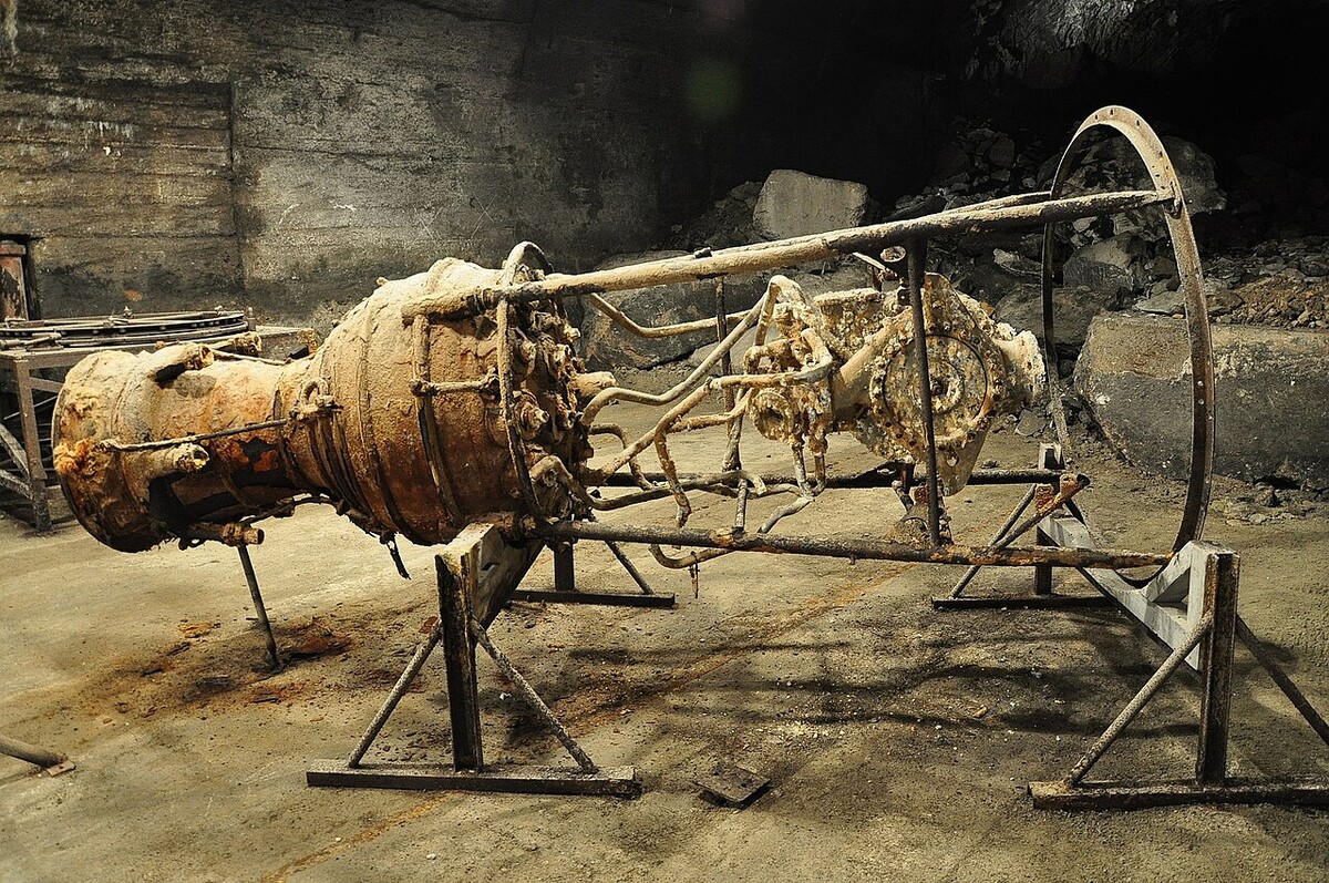 A rusting V-2 engine in the original underground production tunnels at the Mittelbau-Dora concentration camp memorial