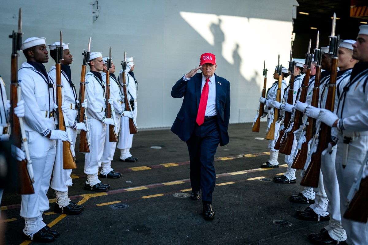 President Donald Trump salutes sailors as he walks toward the stage to deliver remarks in honor of the U.S. Navy 250th anniversary celebration at the USS Harry S. Truman aircraft carrier at Naval Station Norfolk in Norfolk, Virginia. (Official White House Photo by Daniel Torok)